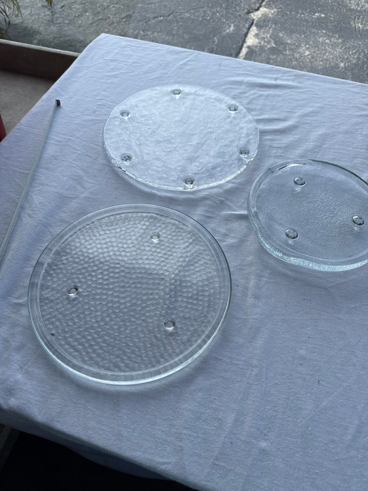 3 different glass plates with feet sold individually