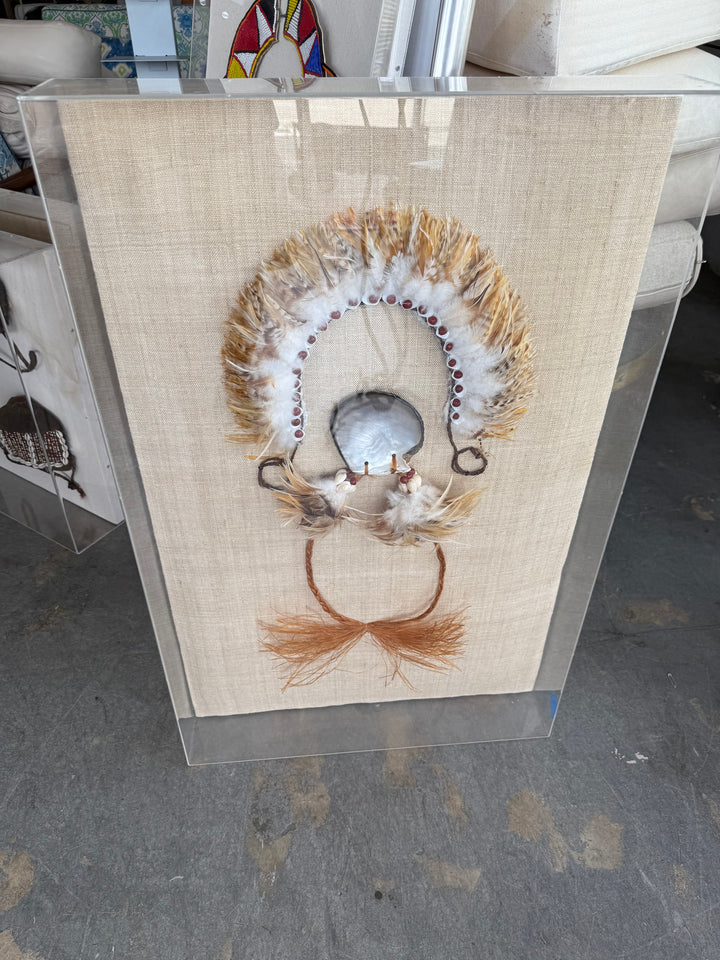 Various tribal items in 3-D frame