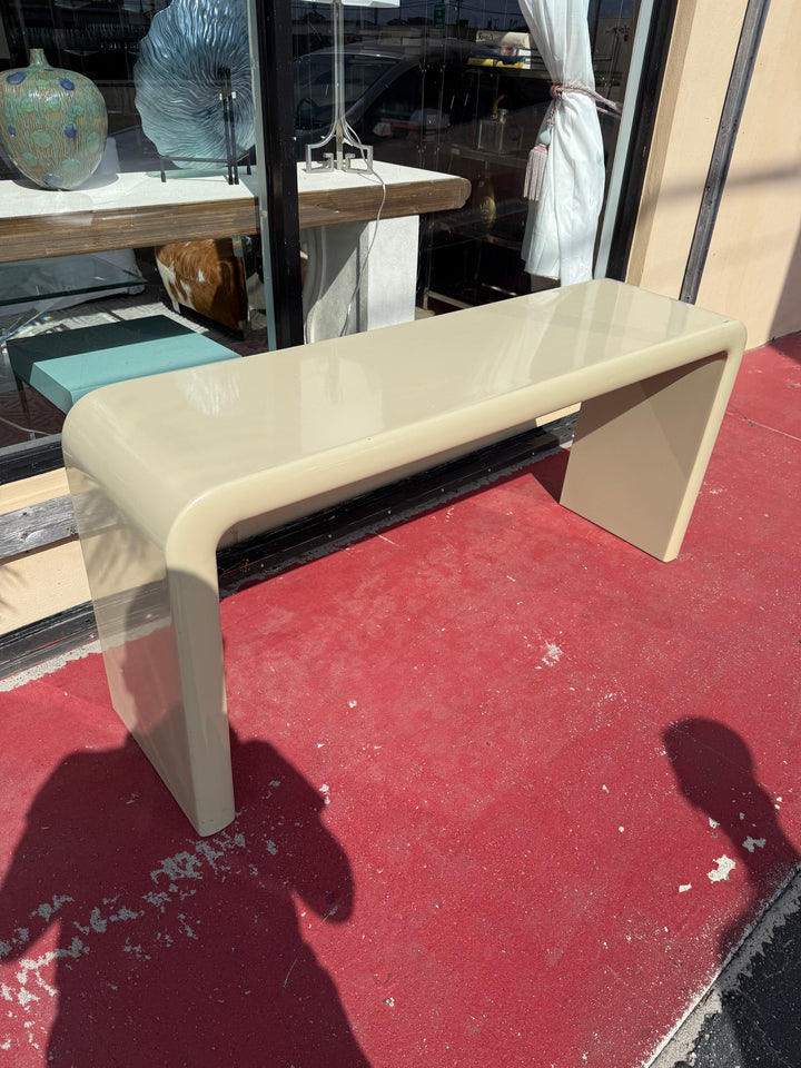 Lacquered waterfall console