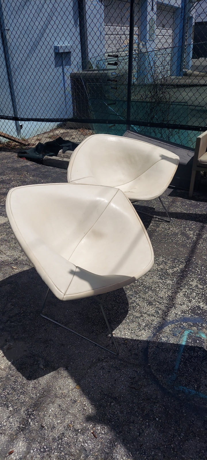 Pr Bertoia? Wire diamond chairs.