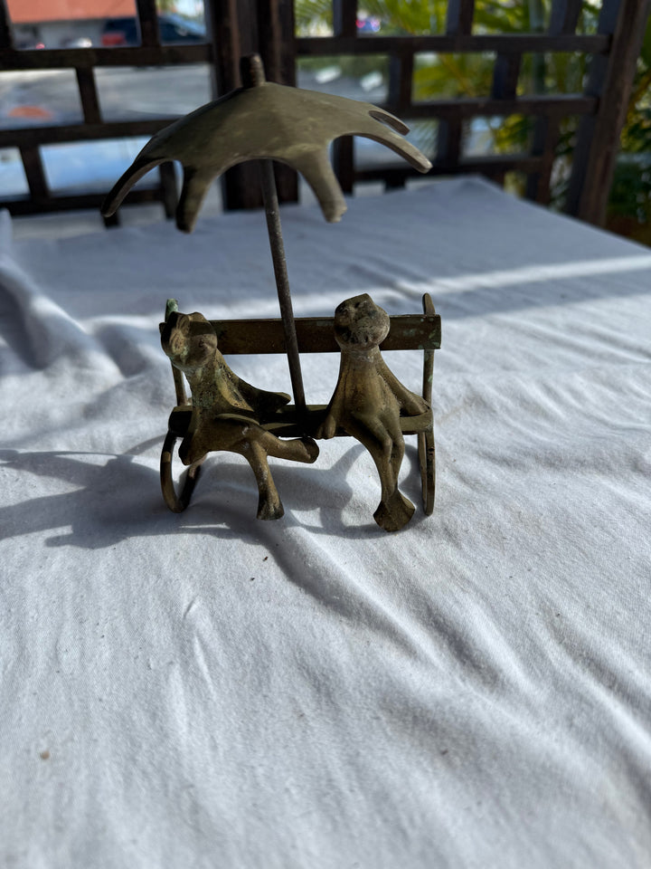 2 frogs on bench Brass?