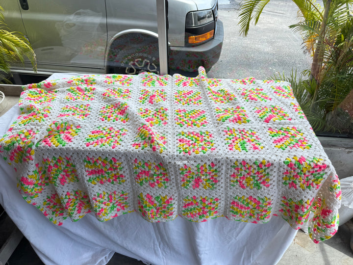Pink yellow green crochet throw