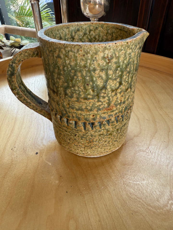 Stamped green pottery pitcher