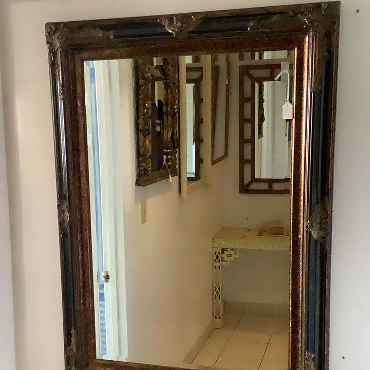 Large black and gold mirror